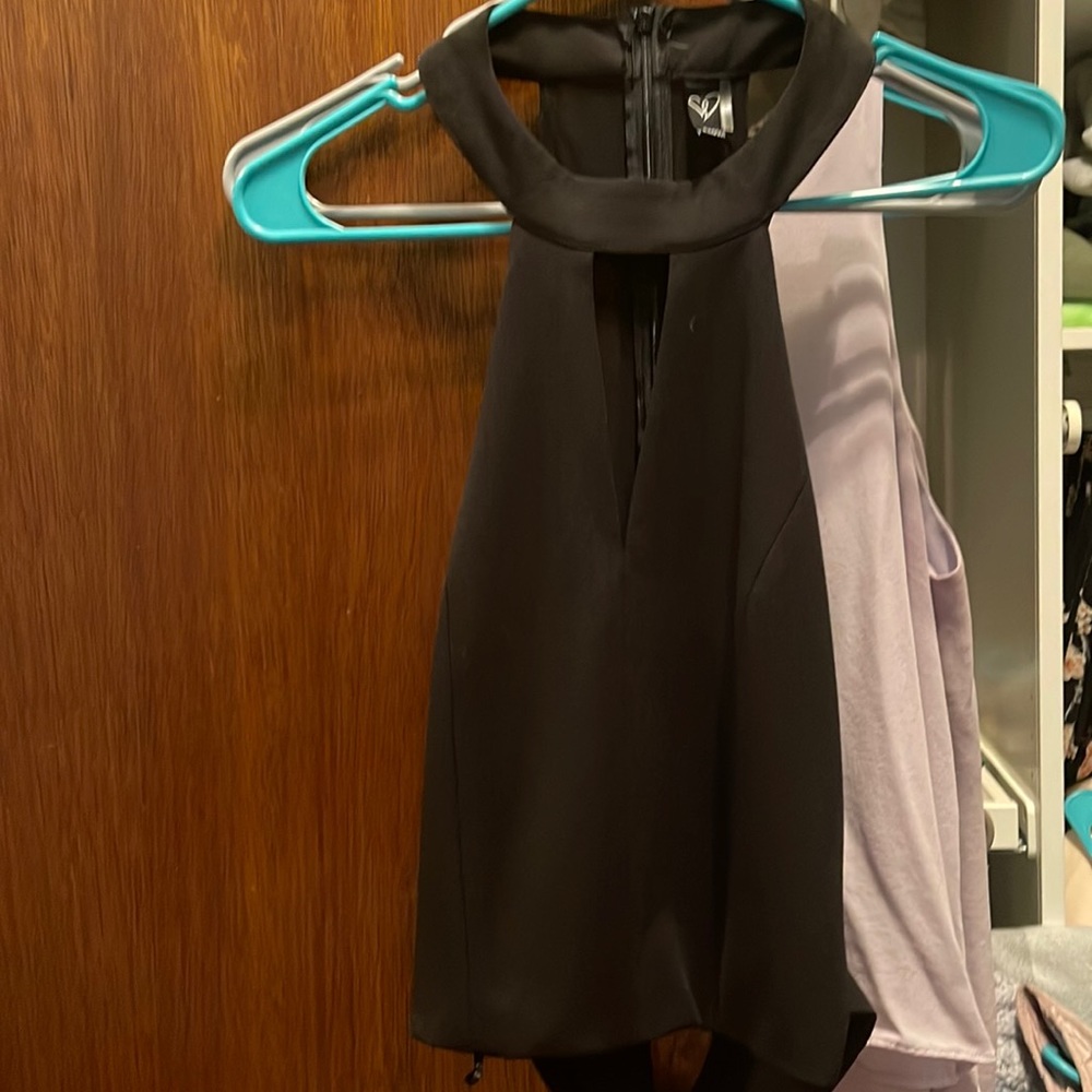 Black top. Size medium. Polyester with mesh back